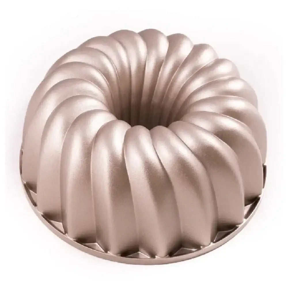 Metallic Bundt cake pan on a white background
