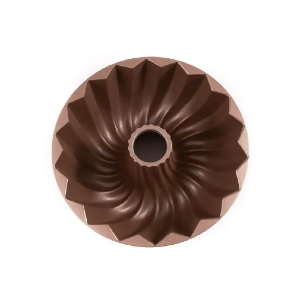 Brown Bundt cake pan on a white background