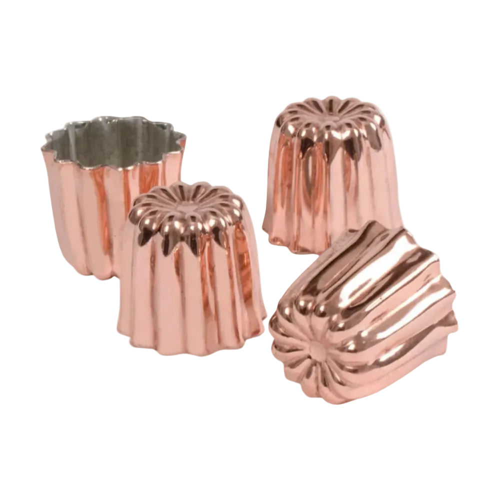 Set of four copper cake molds on a white background