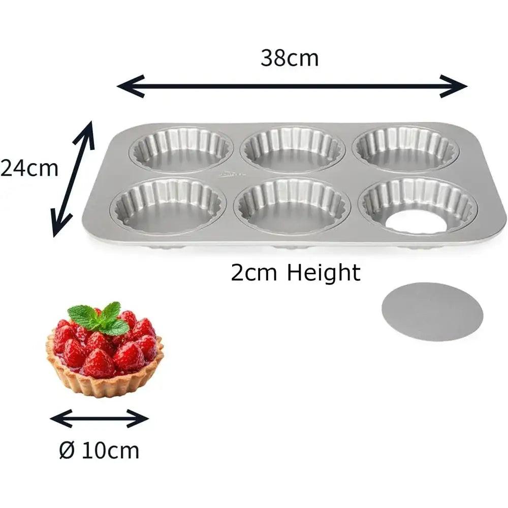 Metal muffin tin with dimensions and a small tart for scale on a white background