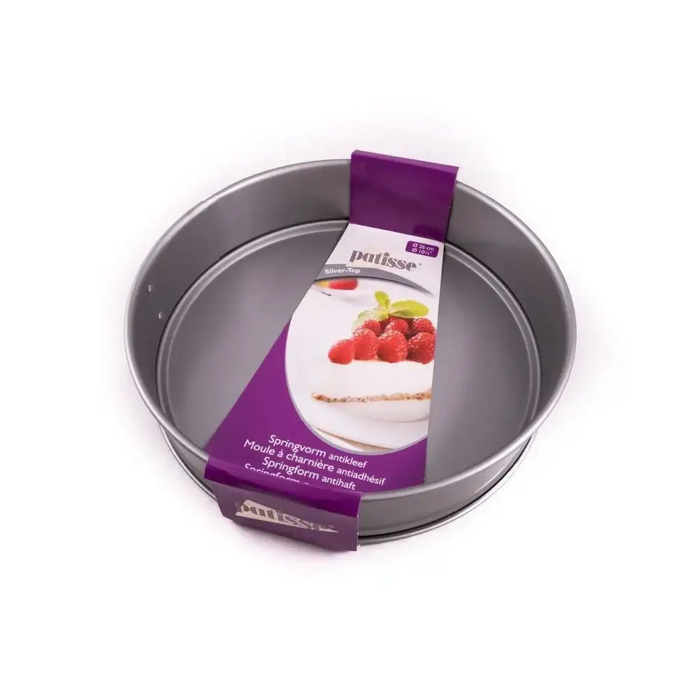 Metal cake pan with a purple packaging label on a white background
