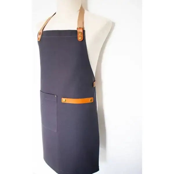 Navy apron with orange accents on a mannequin against a white background