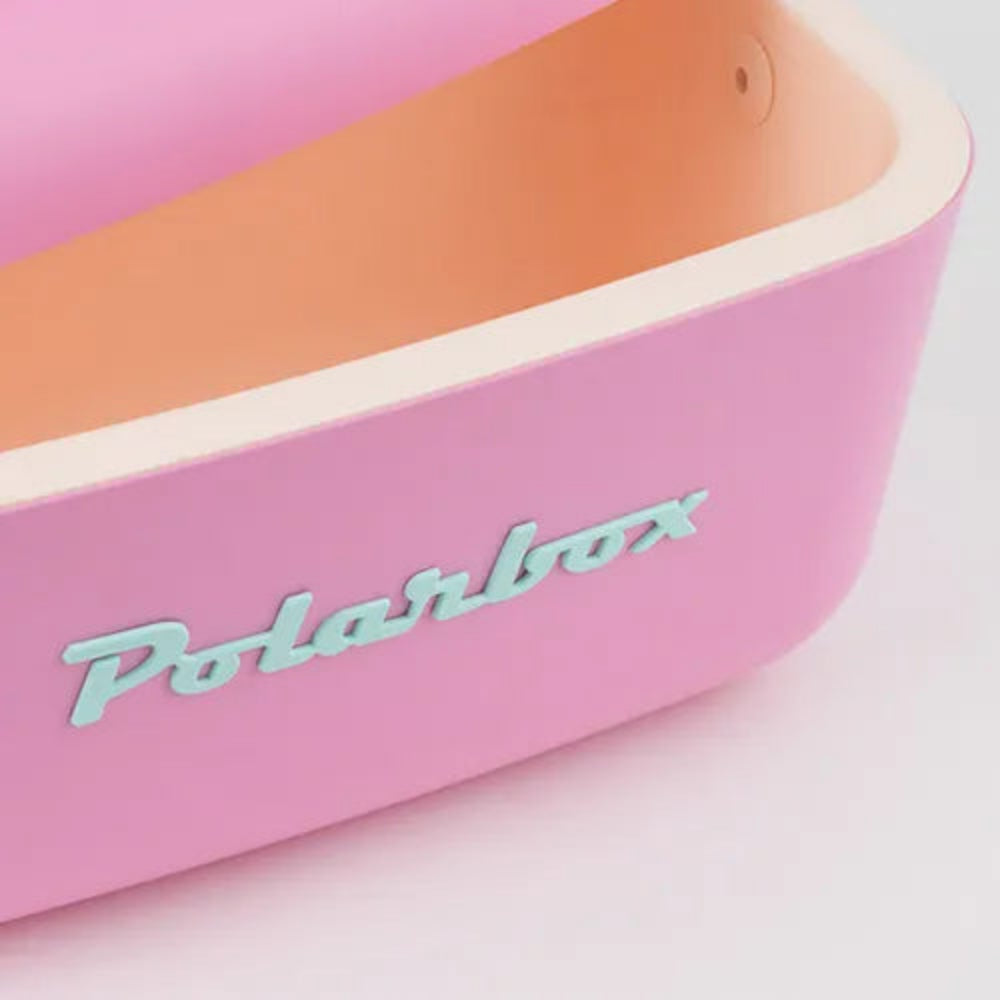 Pink and orange lunch box with 'Polarbox' branding on a light pink background