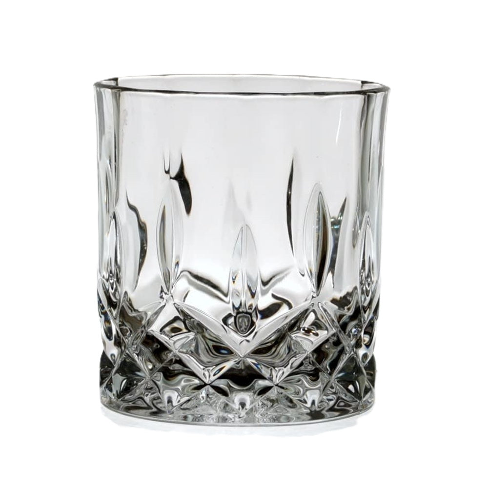 Clear glass tumbler with diamond cut design on a white background