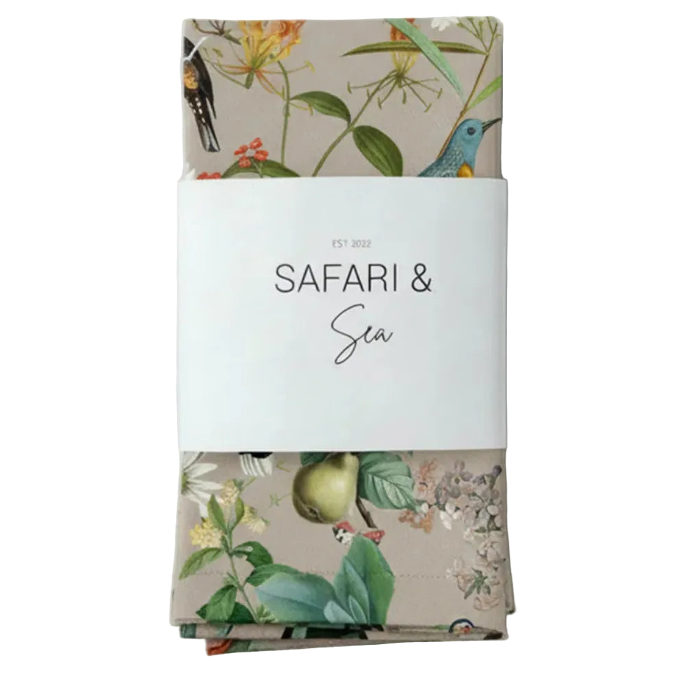 Pack of napkins with floral design and 'Safari & Sea' text on a white background