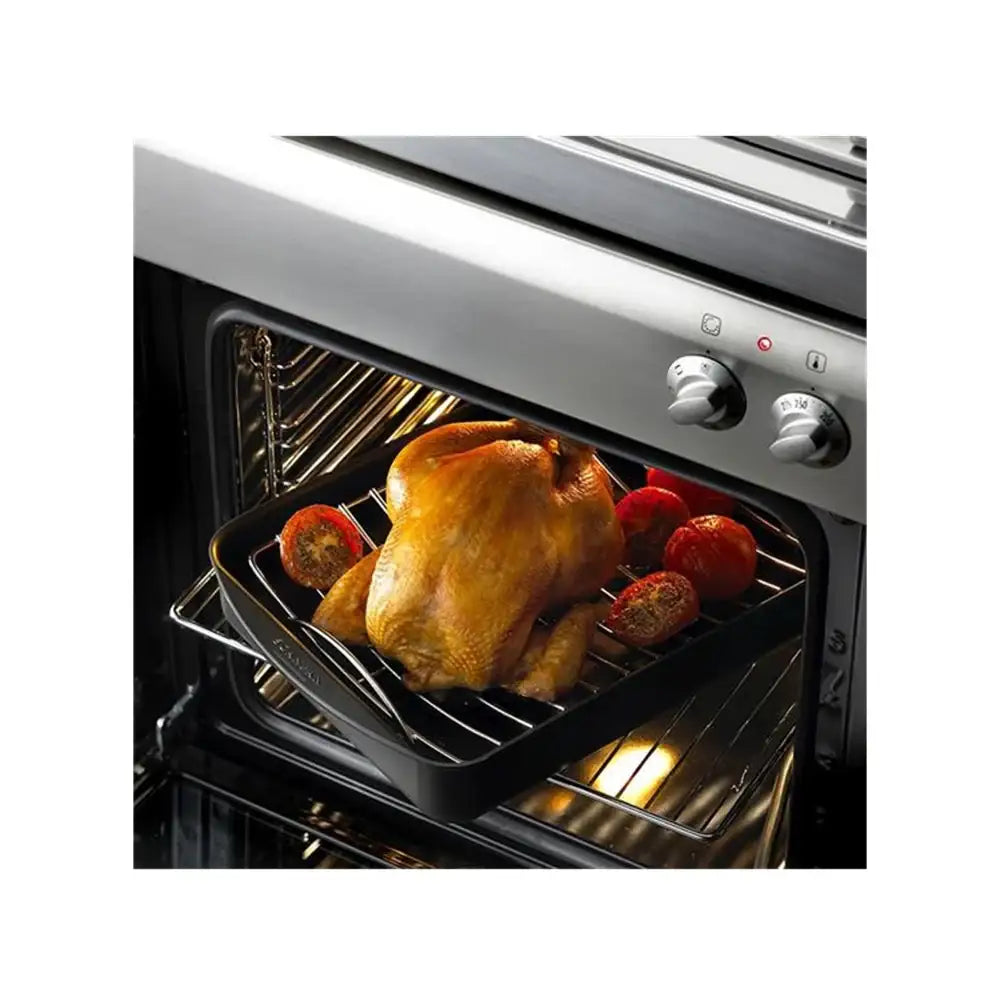 Roasted chicken in an oven with vegetables on a white background