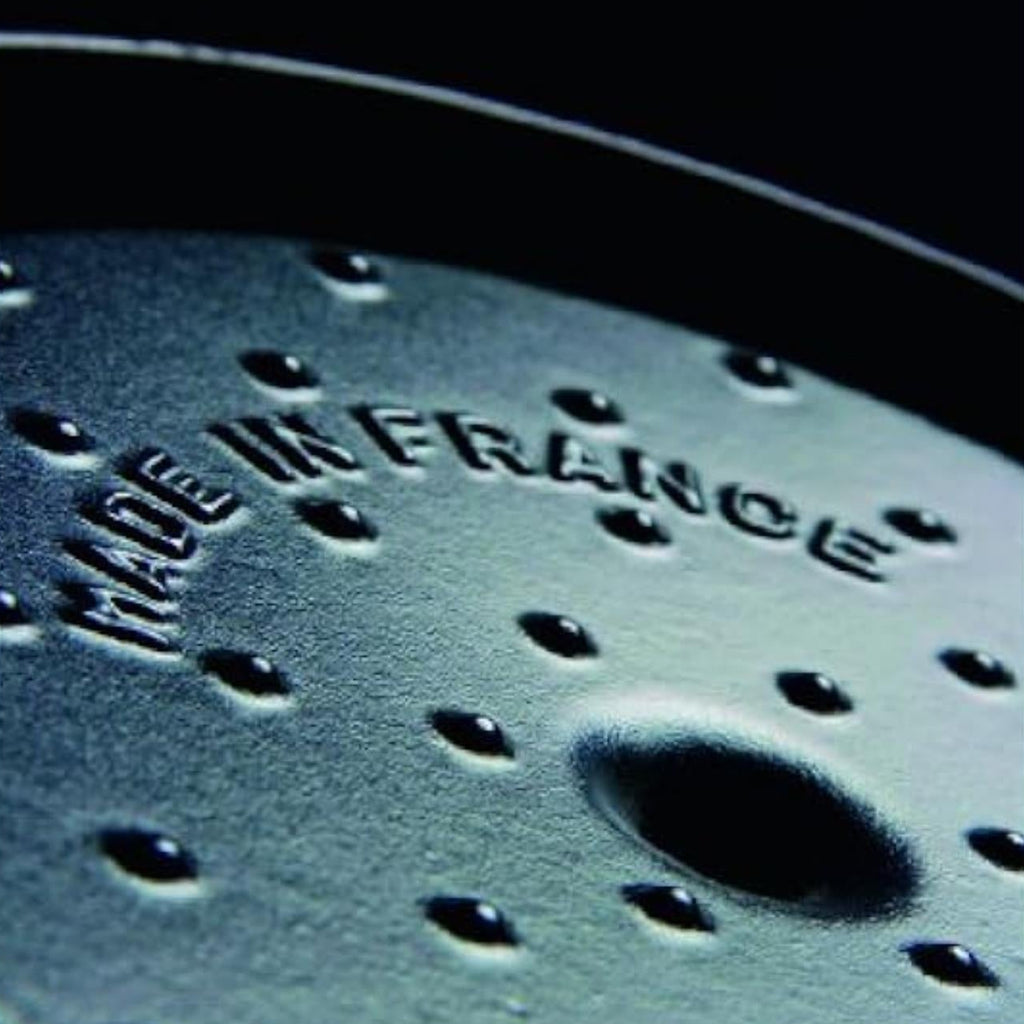 Metallic surface with 'Made in France' engraving