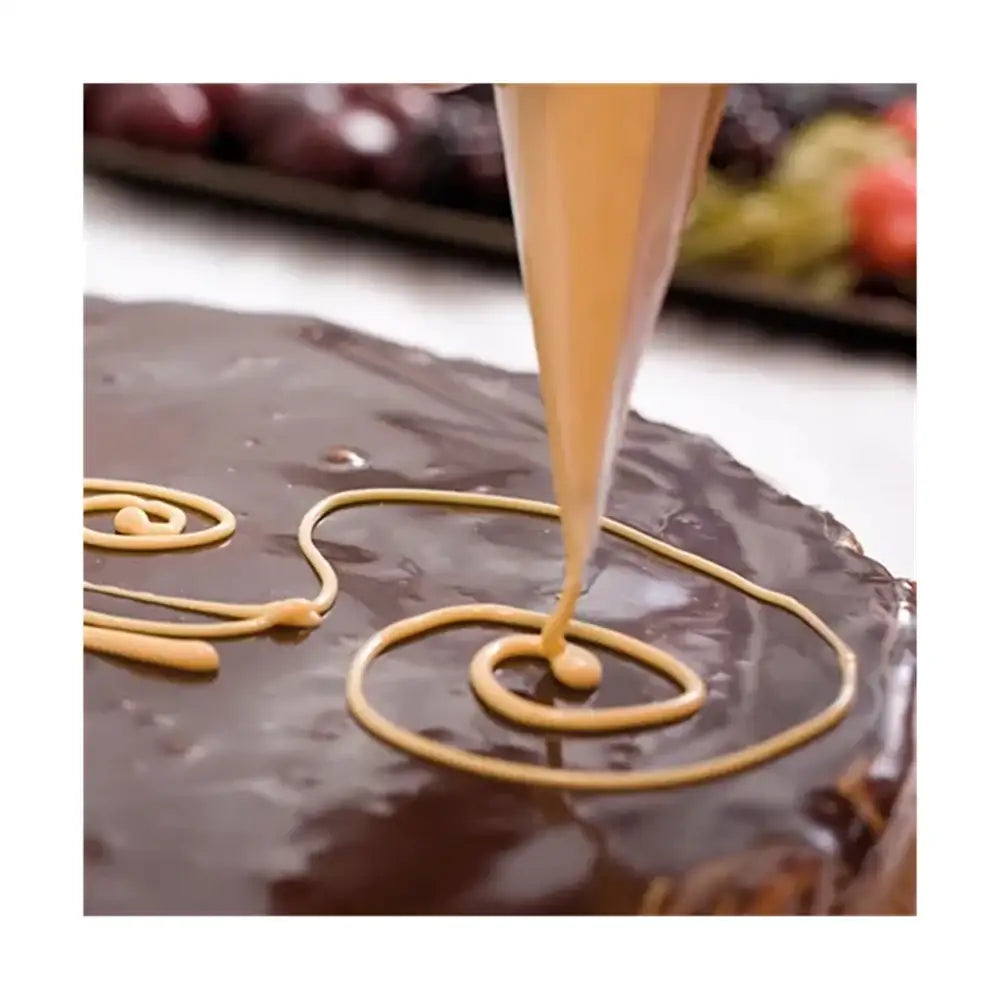 Chocolate cake with caramel being drizzled on top