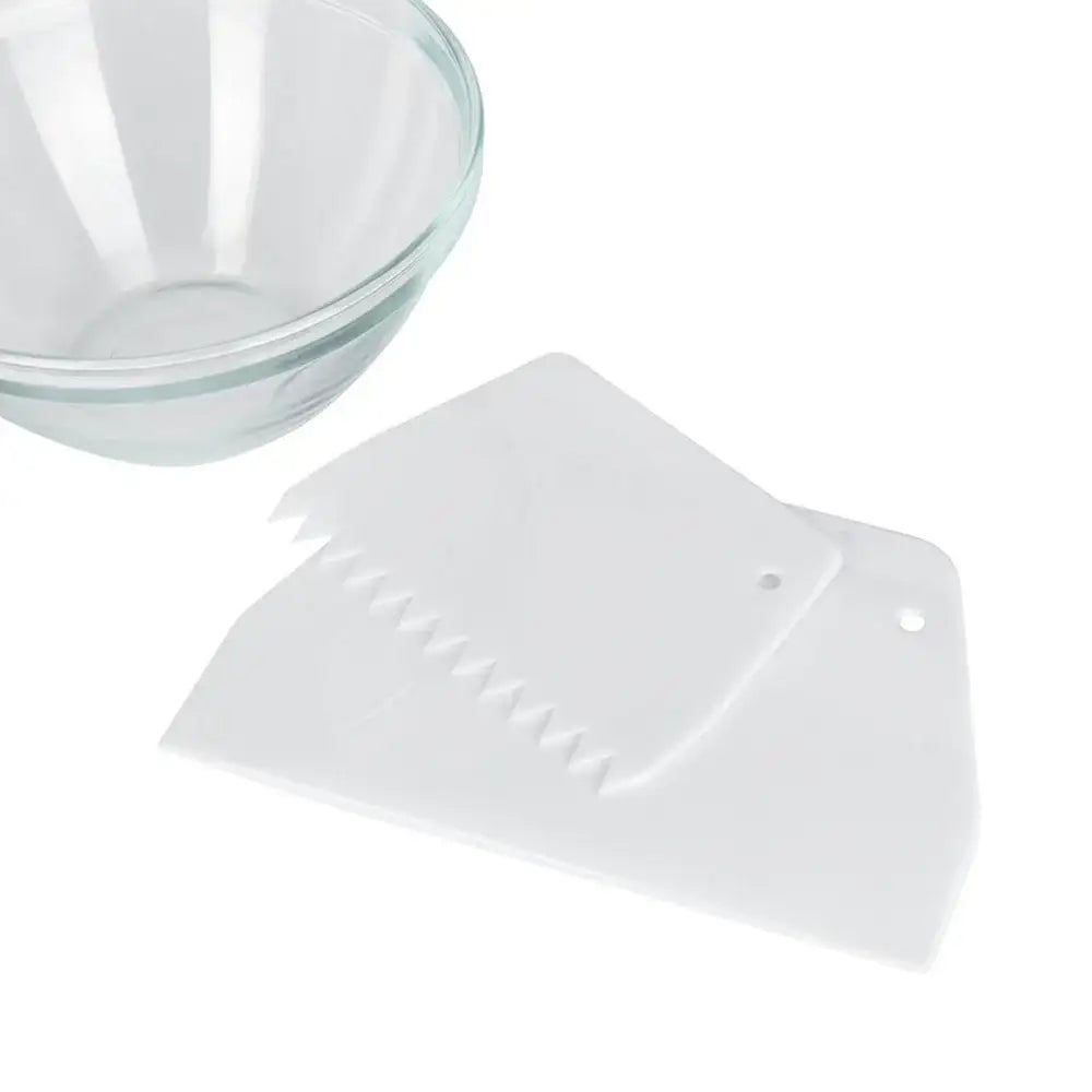 Clear glass bowl and white plastic dividers on a white background