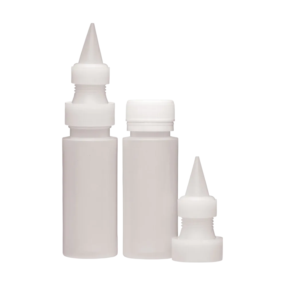Three white icing plastic bottles with different sizes on a white background