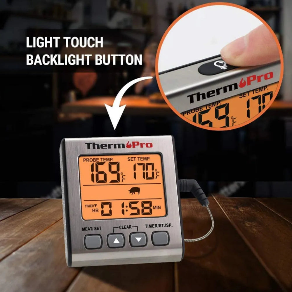 Thermopro digital thermometer with light touch backlight button on a wooden surface.