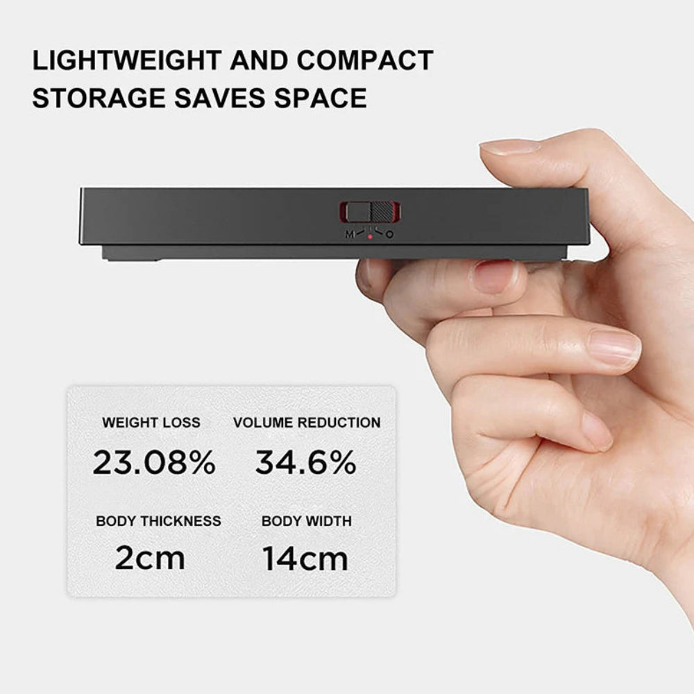 Hand holding a small black device with text about weight loss, volume reduction, and dimensions.