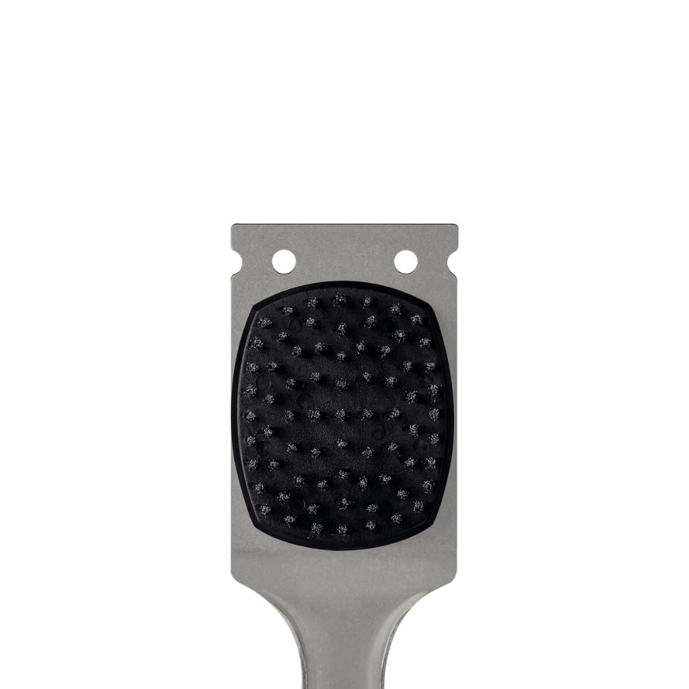 Close up of a grill brush scraper on a white background.
