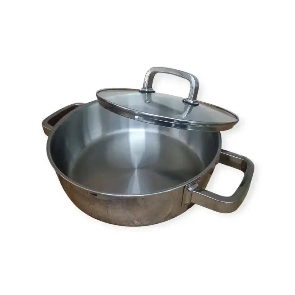 Stainless steel pot with lid on a white background