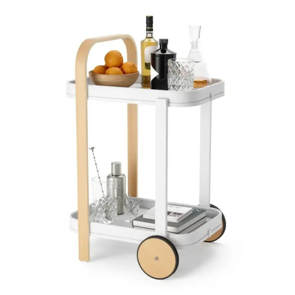 White serving cart with wooden accents, filled with drinks and snacks on a white background