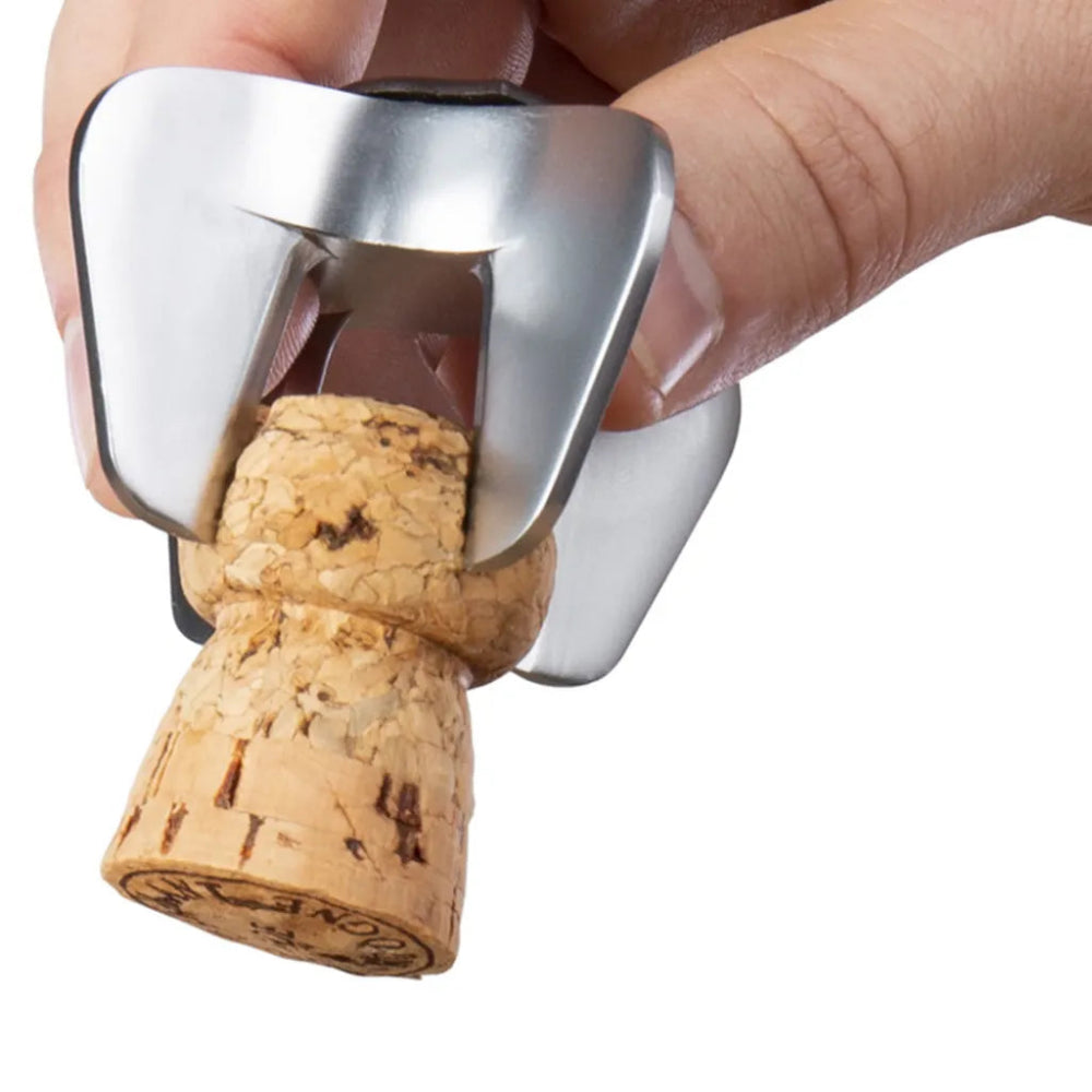 Cork being removed from a bottle using a corkscrew on a white background
