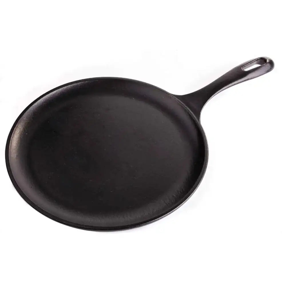 Black cast iron skillet on a white background