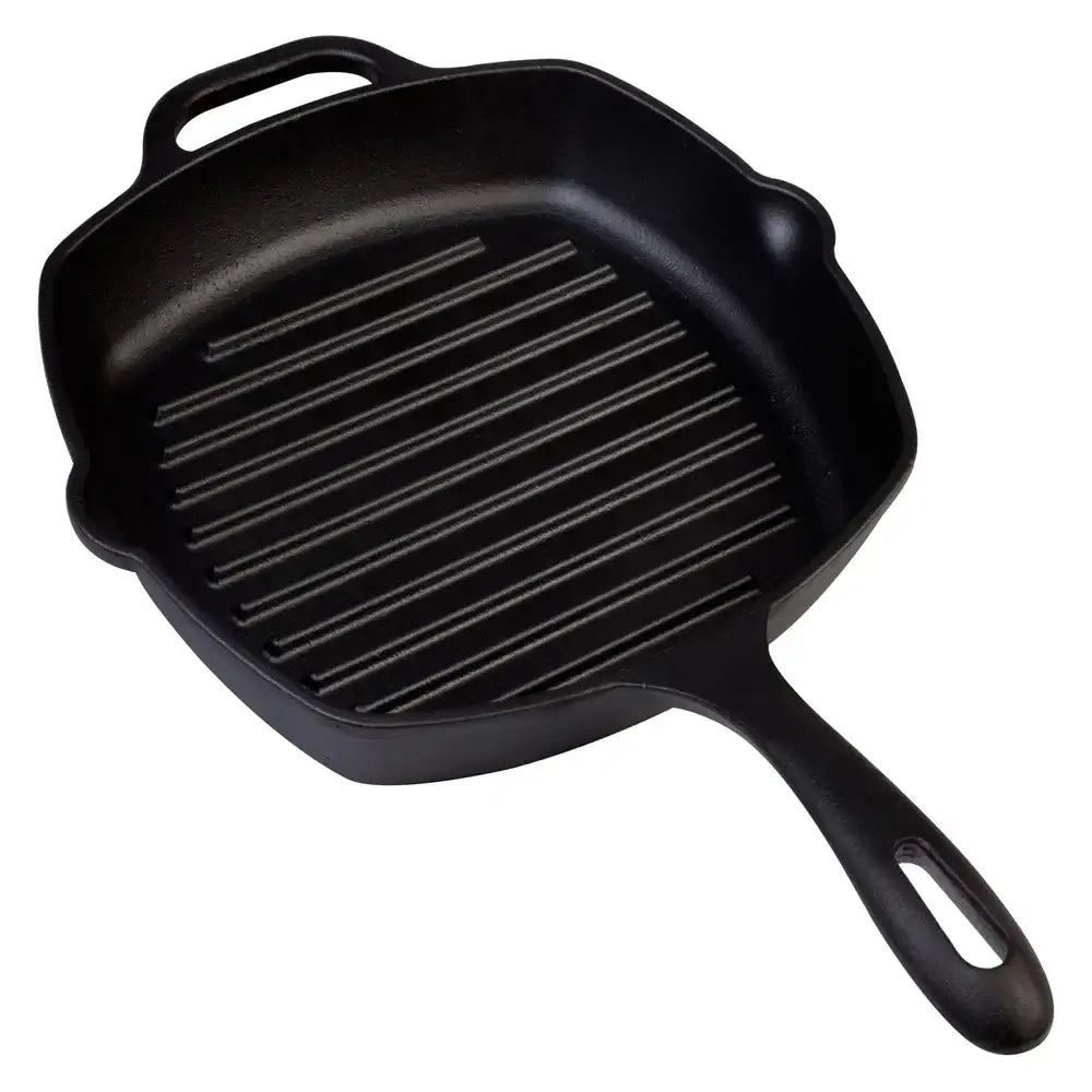 Black cast iron grill pan on a white background