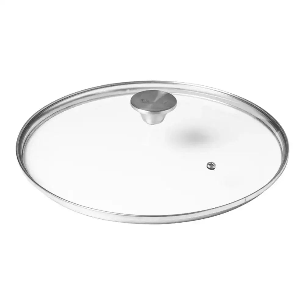 Clear glass lid with silver handle on a white background