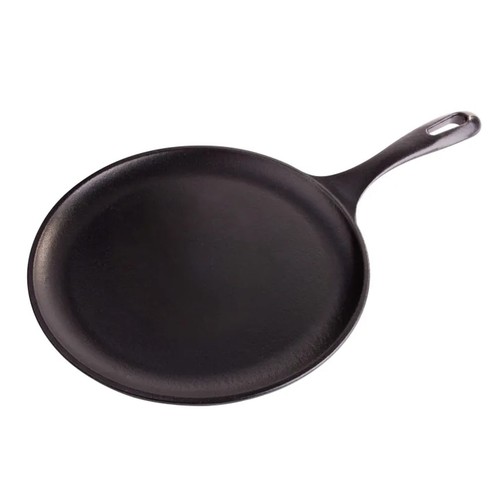 Black cast iron skillet on a white background