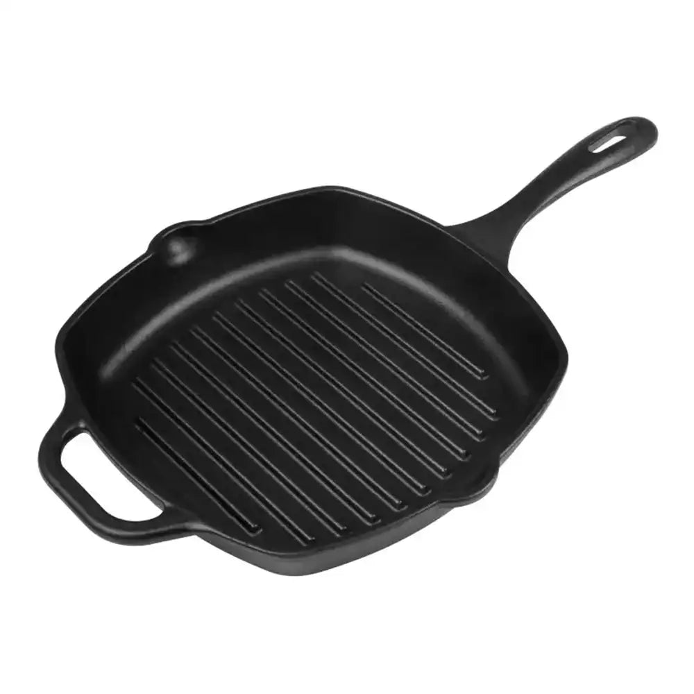 Black cast iron grill pan on a white background
