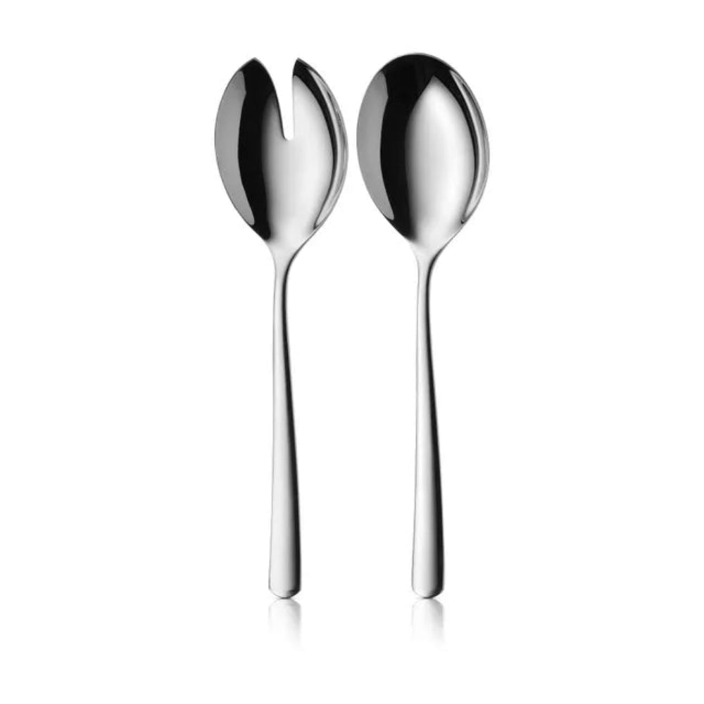 Two polished stainless steel serving utensils, one a salad server with a split bowl and one a soup spoon, standing upright on a white background.