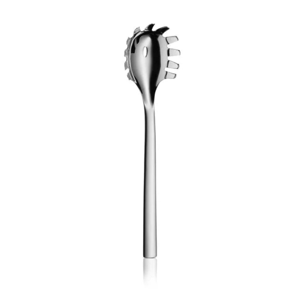 A polished stainless steel spaghetti server with a long handle and a curved head featuring six tines, shown vertically against a solid white background.