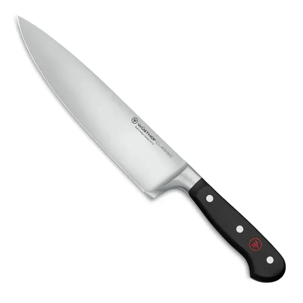 Chef's knife with black handle on a white background