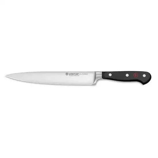 Chef's knife with a black handle on a white background