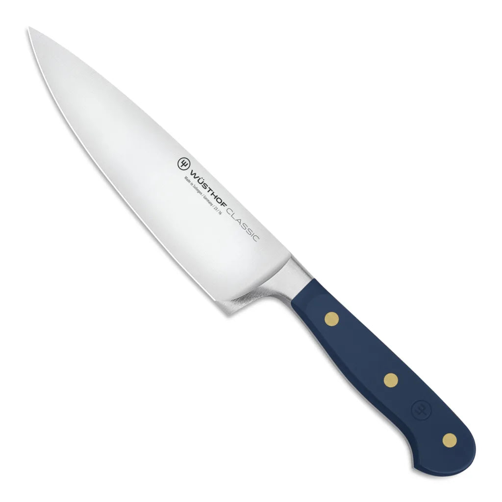Chef's knife with a blue handle on a white background