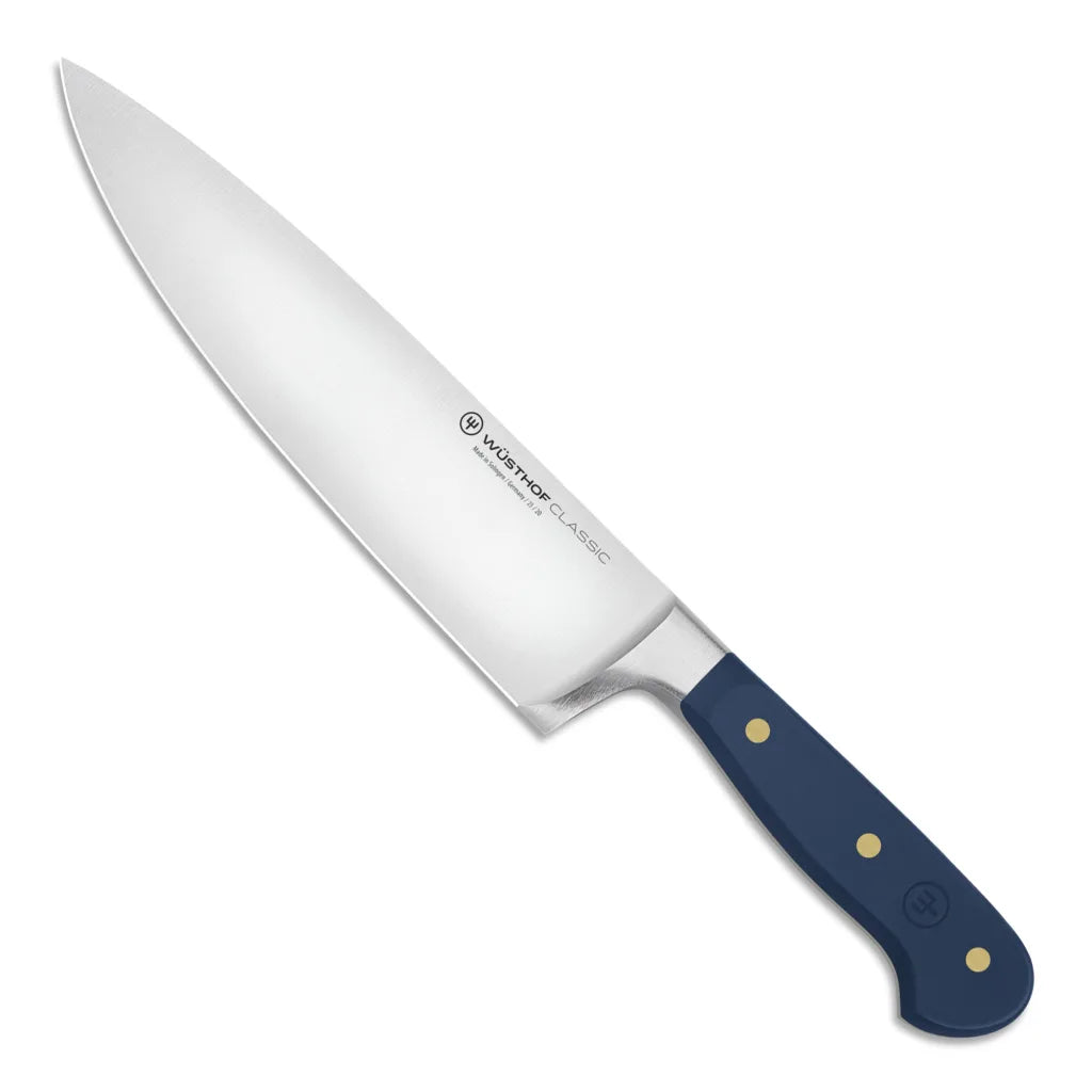 Chef knife with a blue handle on a white background