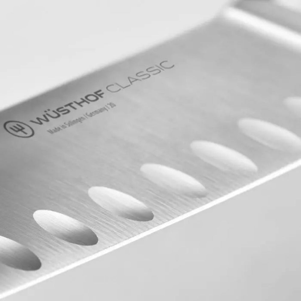 Wüsthof Classic knife blade with brand logo on a white background