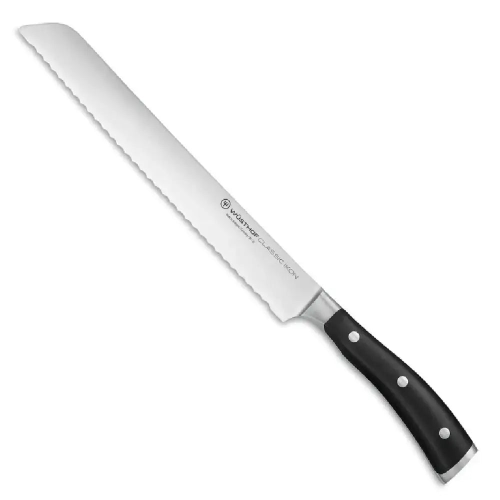 Bread knife with a black handle on a white background