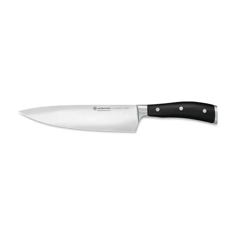 Chef's knife with black handle on a white background