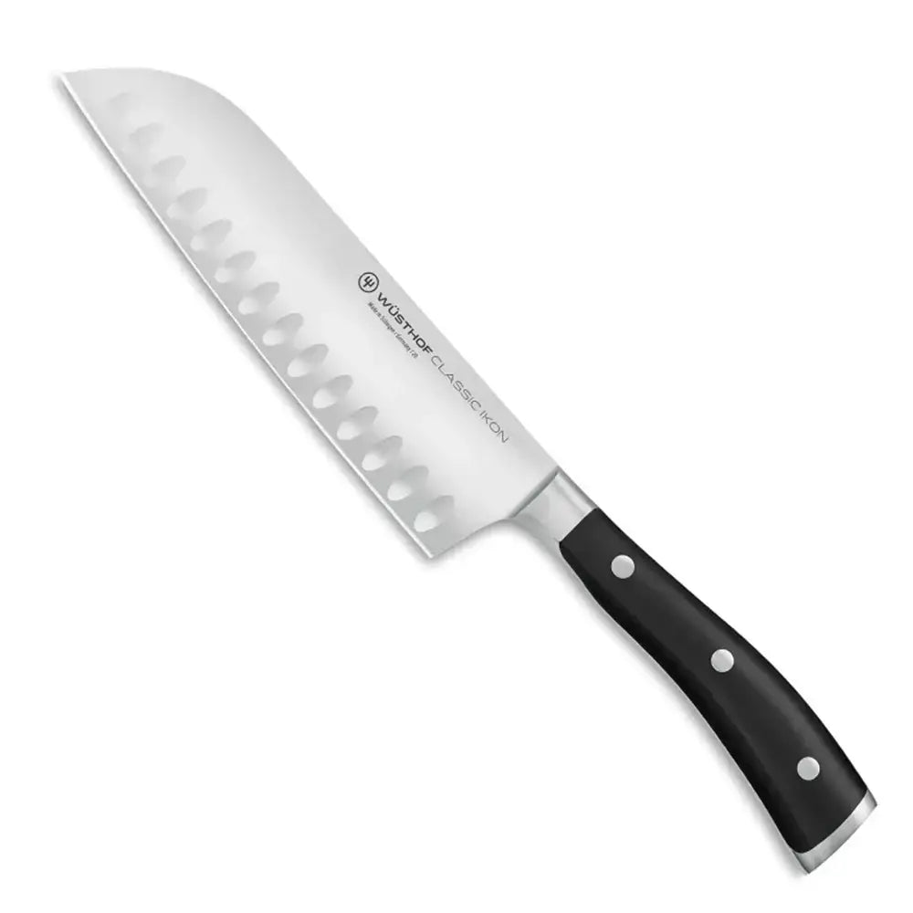 Chef's knife with black handle on a white background