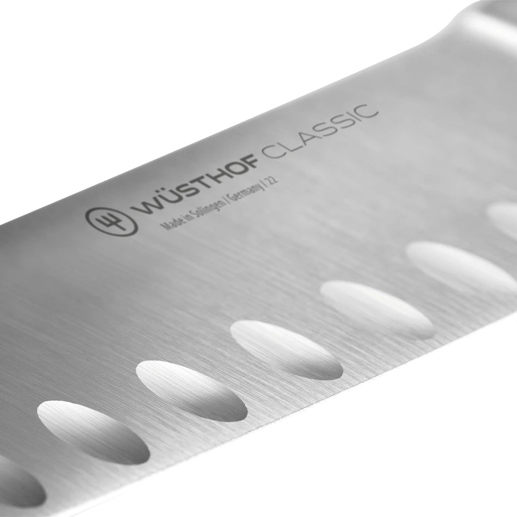 Close-up of a Wusthof Classic knife blade on a white background