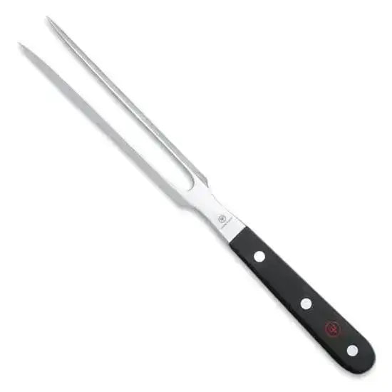 Metal carving fork with black handle on a white background