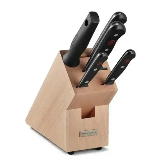 Set of knives in a wooden block with Wüsthof logo on a white background
