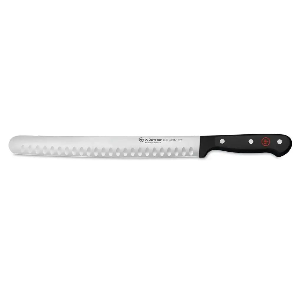 Long bread knife with a black handle on a white background