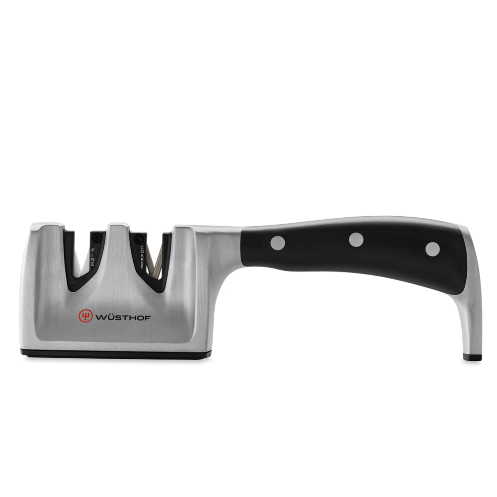 A Wusthof knife sharpener with a brushed silver metal body and a black handle, shown on a plain white background.