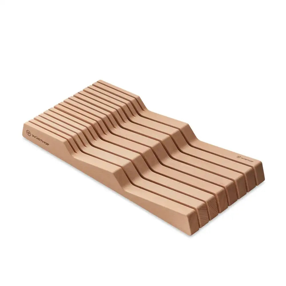 Wooden knife block with multiple slots on a white background