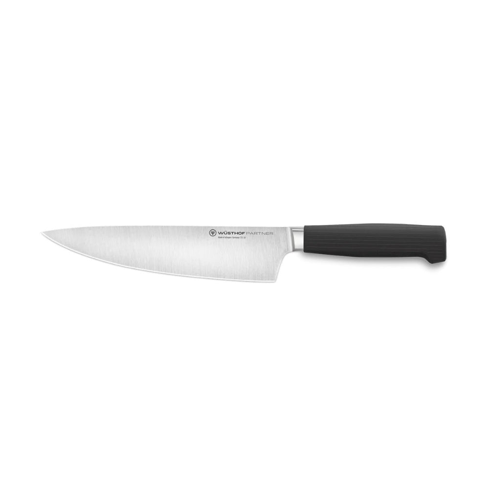 Chef's knife with black handle on a white background