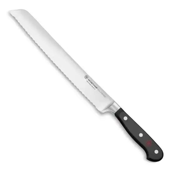 Bread knife with a black handle on a white background