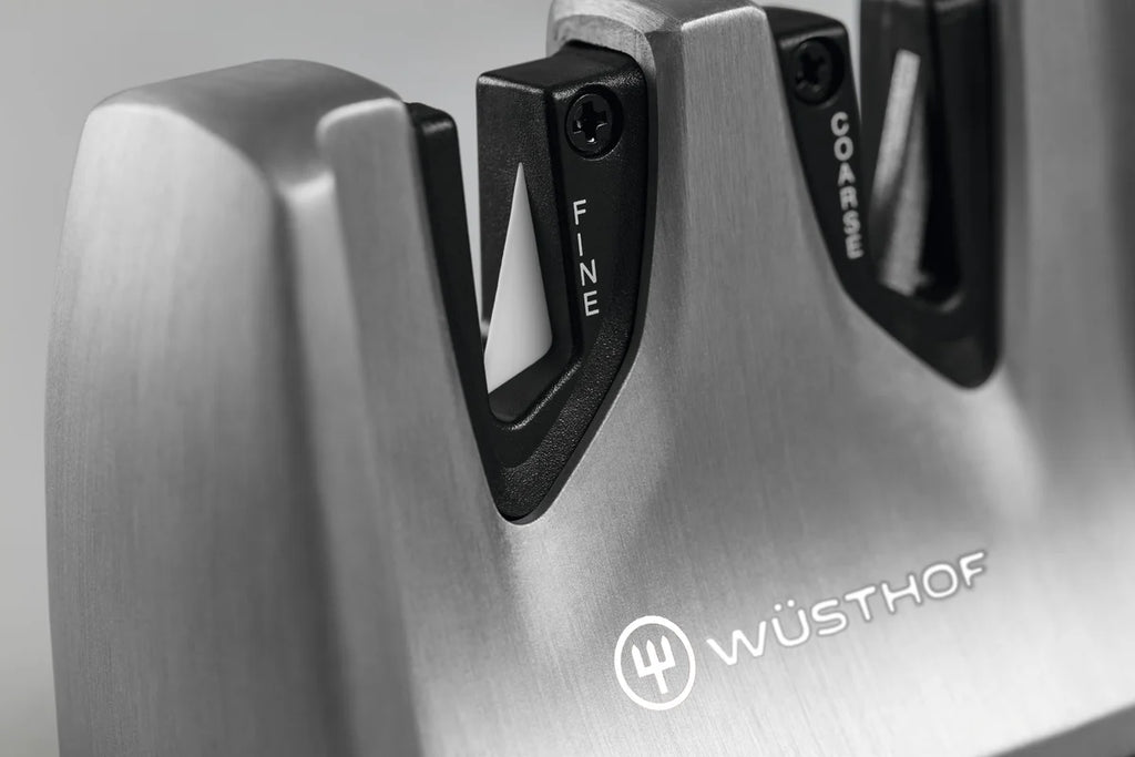 A Wusthof Ikon pull through knife sharpener showing the fine ceramic and coarse tungsten steel sharpening blades