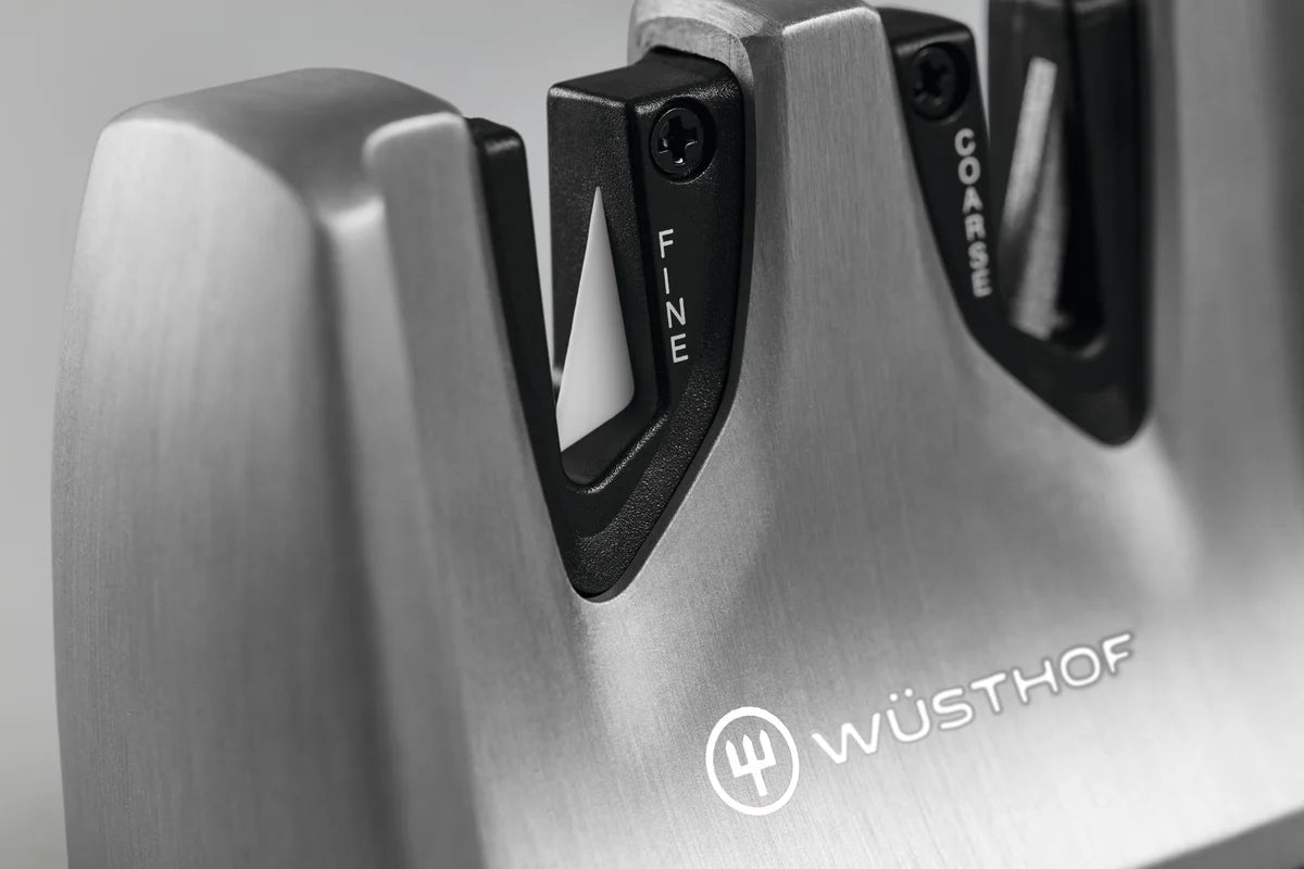A Wusthof Ikon pull through knife sharpener showing the fine ceramic and coarse tungsten steel sharpening blades