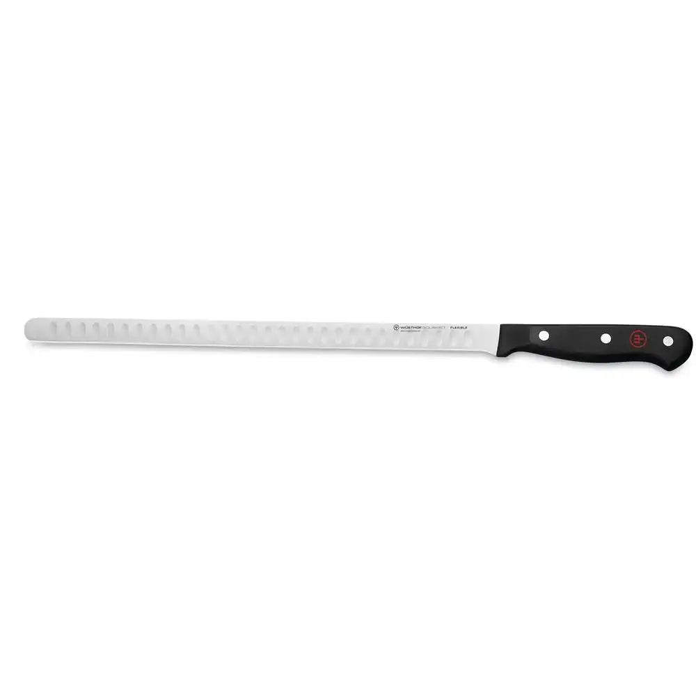 Long serrated knife with a black handle on a white background