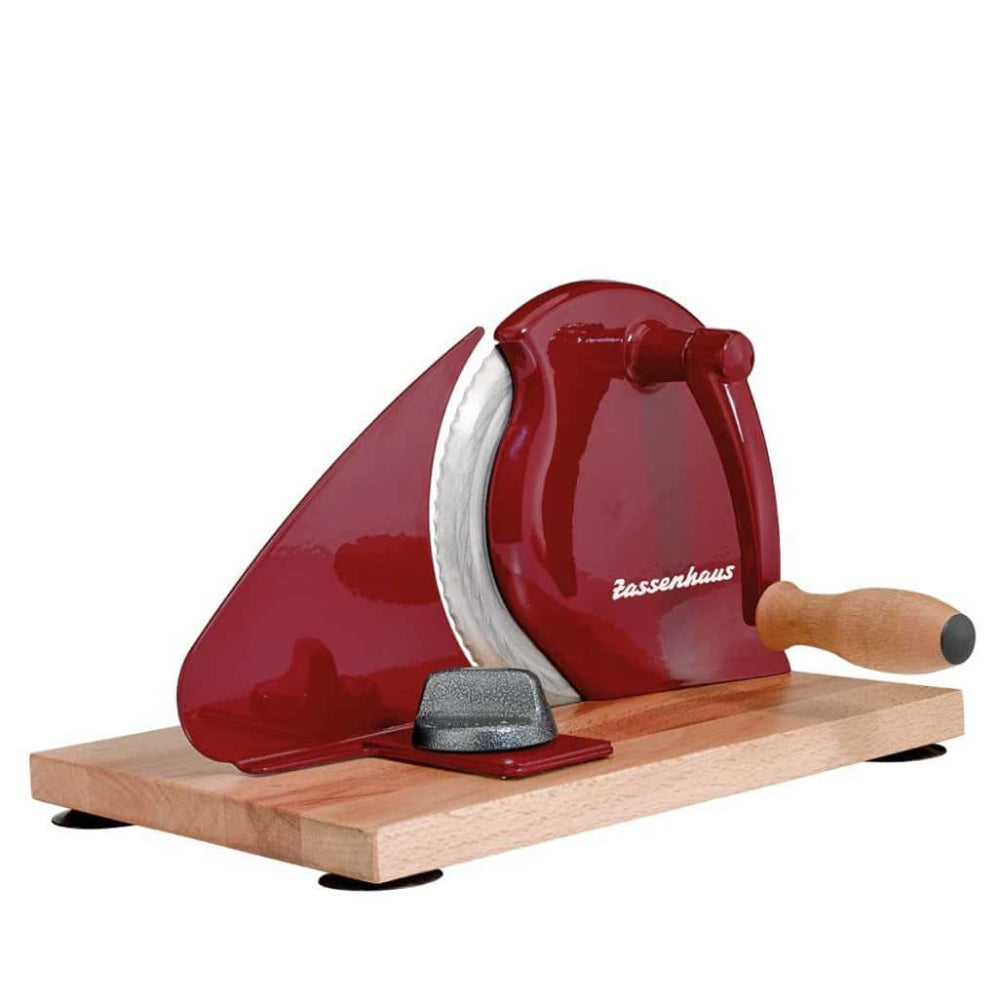 Red bread, meat and cheese manual slicer with wooden base on a white background