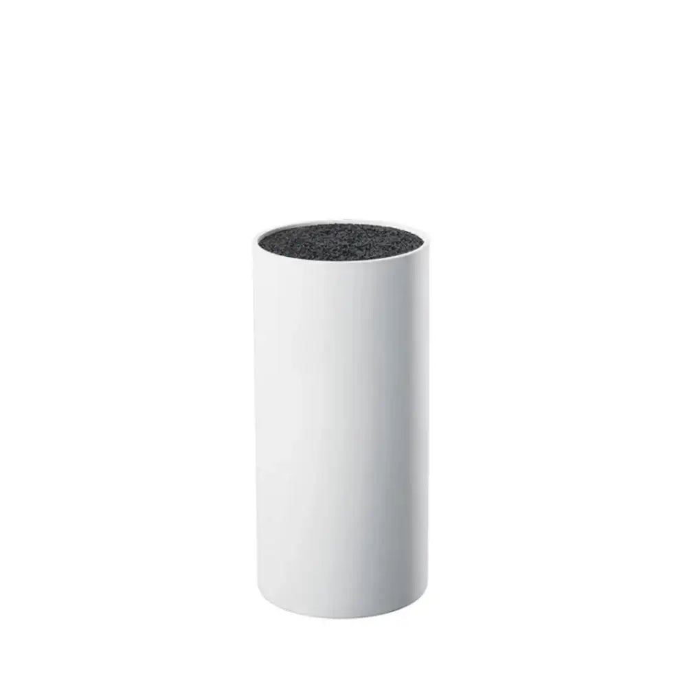 White cylindrical container with a black textured top on a white background