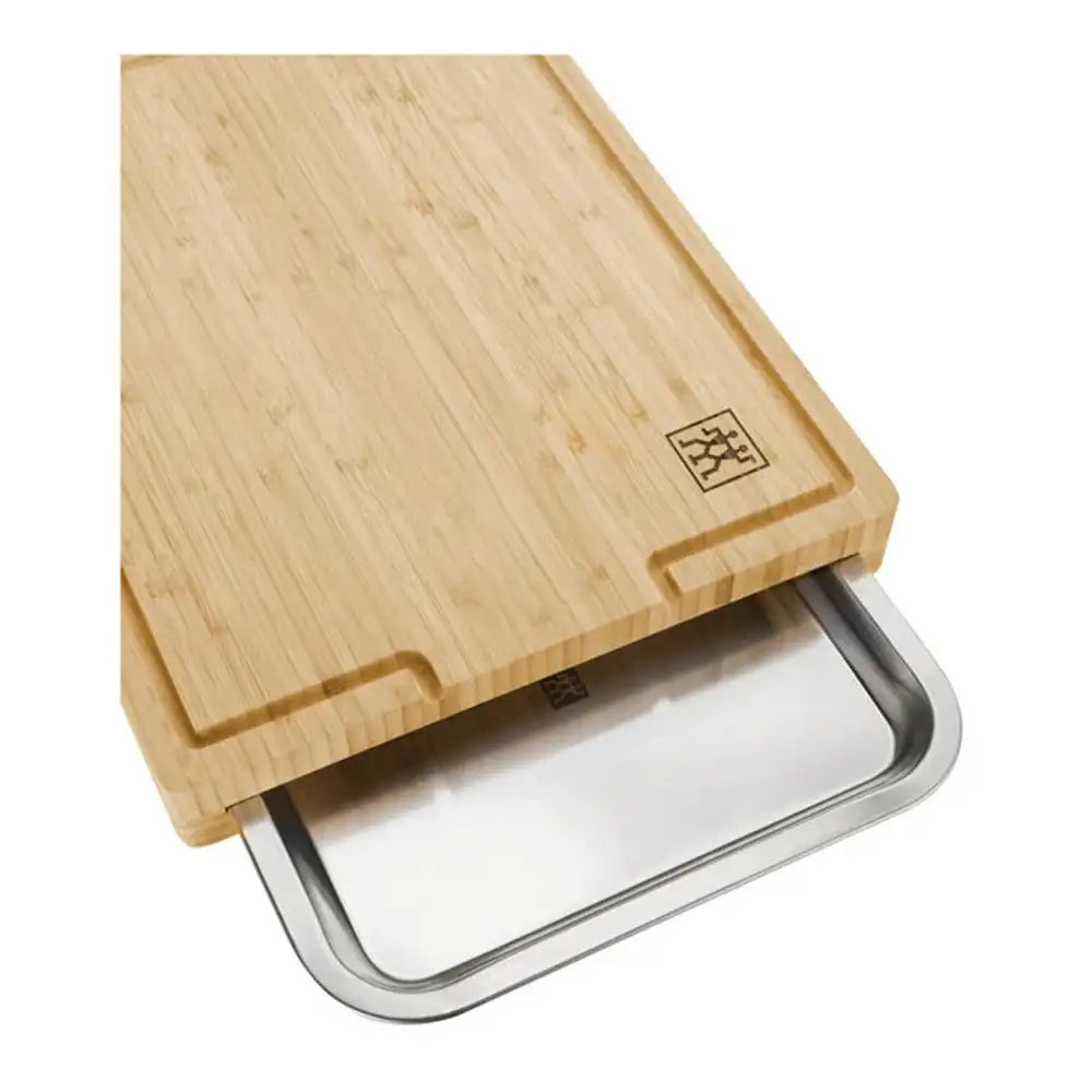Wooden cutting board with metal tray on a white background