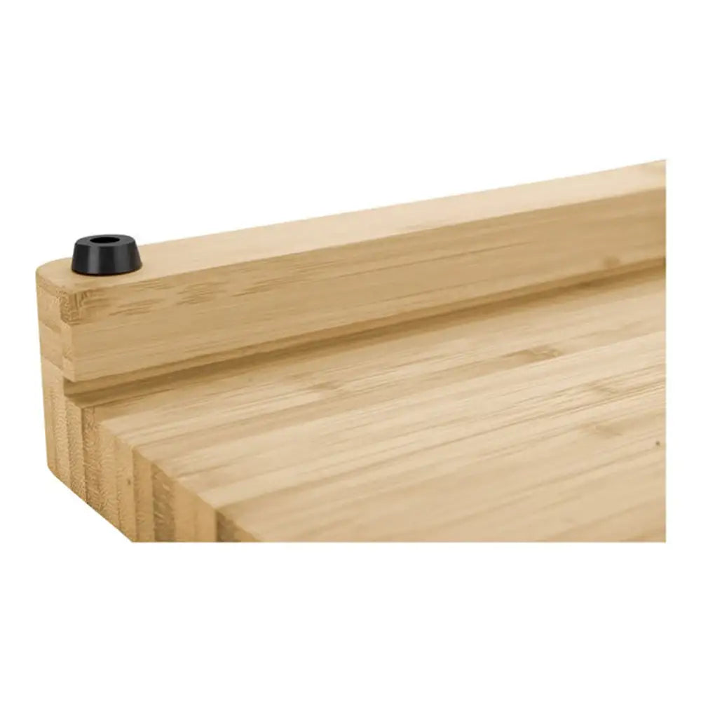 Wooden board with a black cylindrical object on a white background